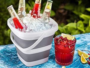 Collapsible bucket used as an outdoor ice bucket for drinks